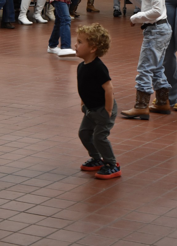 Families at rodeo dance.