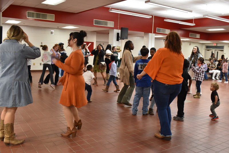 Families at rodeo dance.