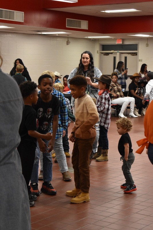 Families at rodeo dance.
