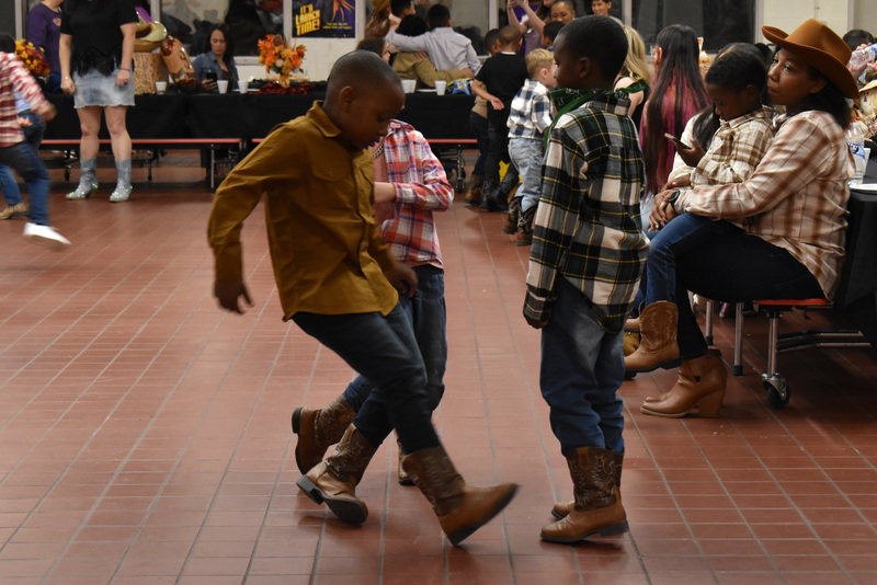 Families at rodeo dance.