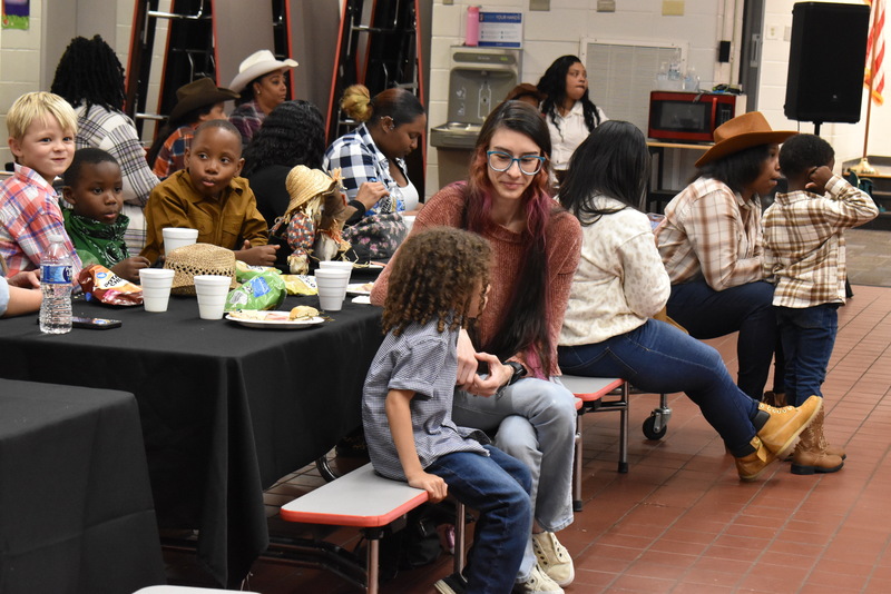 Families at rodeo dance.