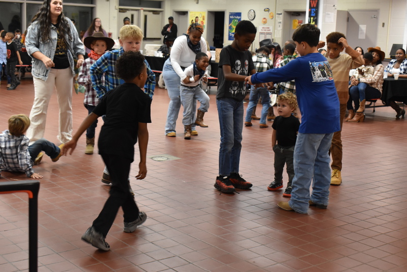 Families at rodeo dance.