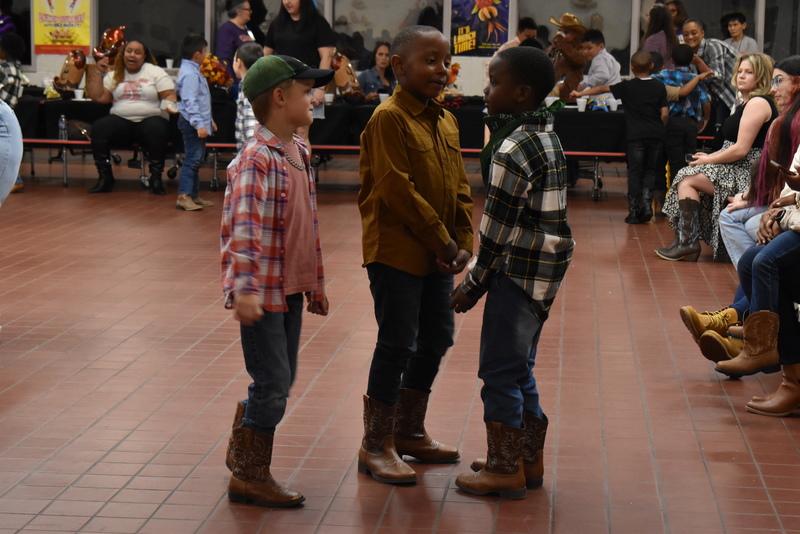 Families at rodeo dance.