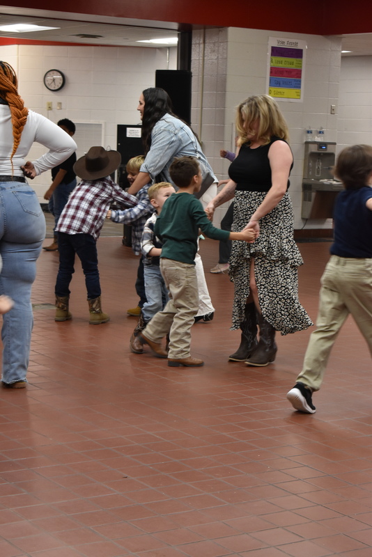 Families at rodeo dance.