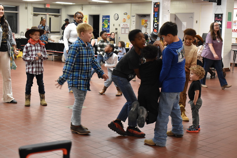 Families at rodeo dance.