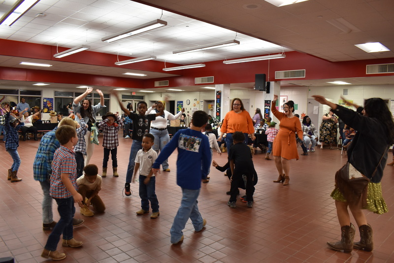 Families at rodeo dance.