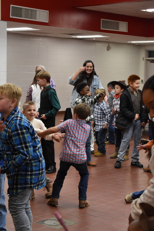 Families at rodeo dance.