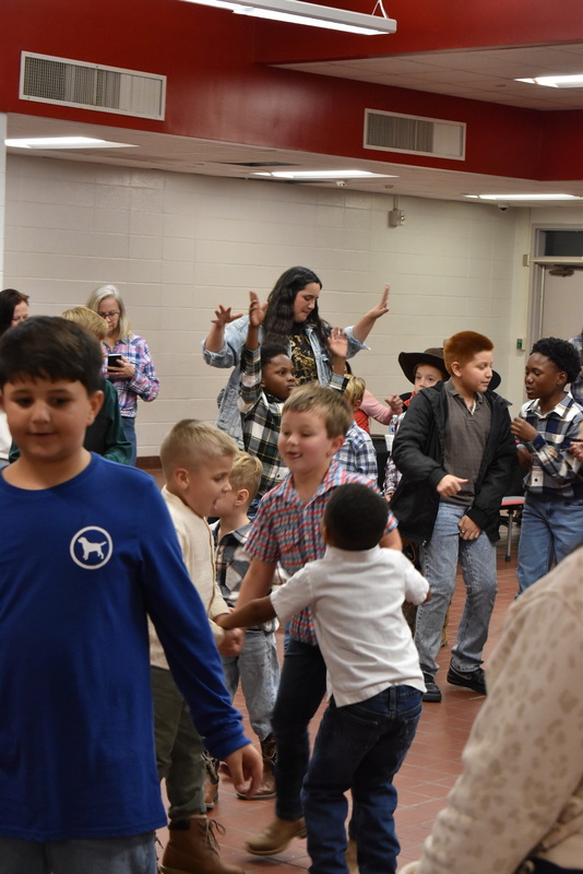 Families at rodeo dance.