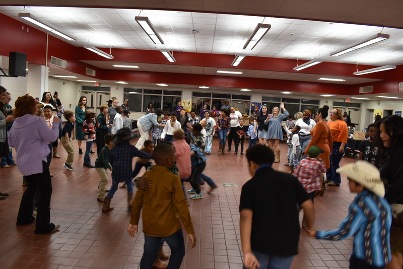 Families at rodeo dance.