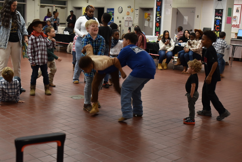 Families at rodeo dance.