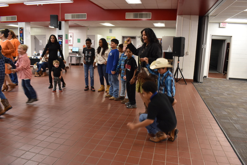 Families at rodeo dance.