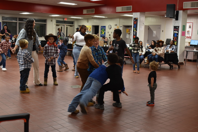 Families at rodeo dance.
