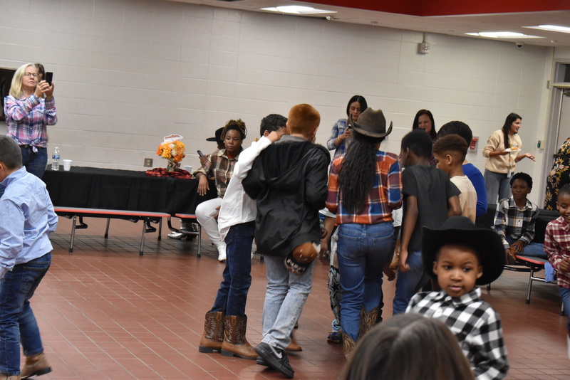 Families at rodeo dance.