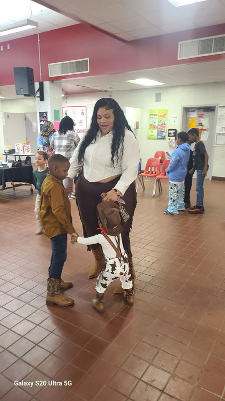 Family dancing at rodeo.