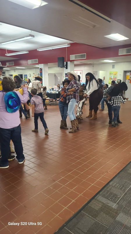 Family dancing at rodeo.
