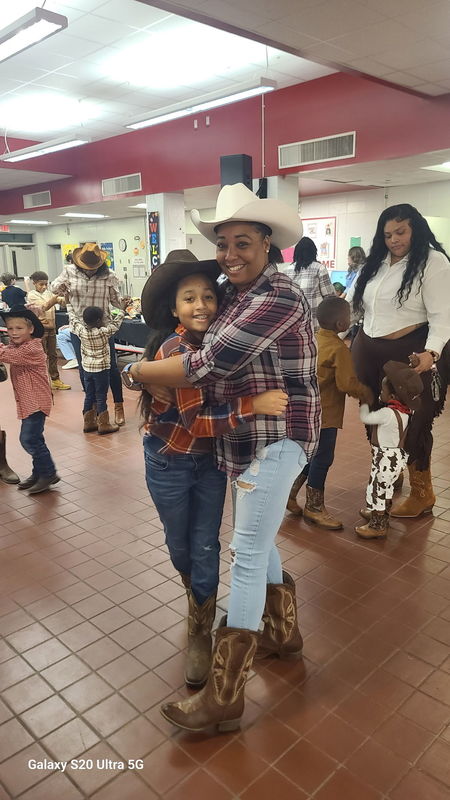 Mother and son hugging.