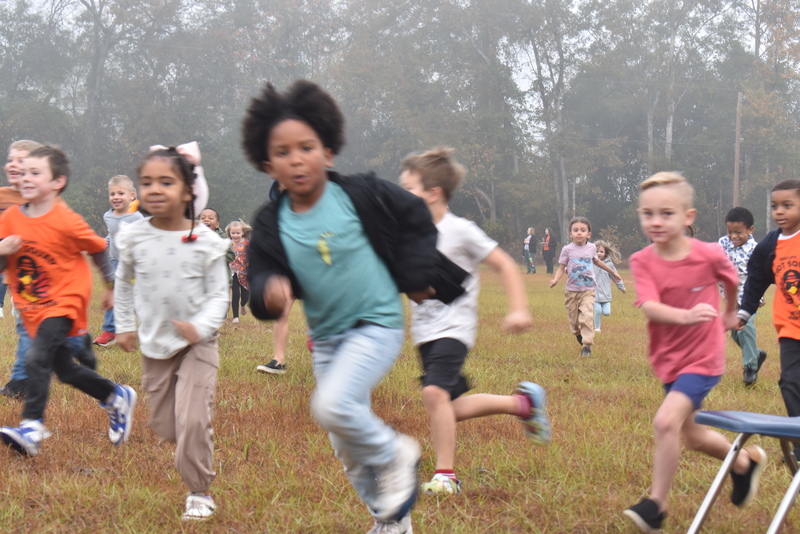 Students running and walking at the Turkey Trot.