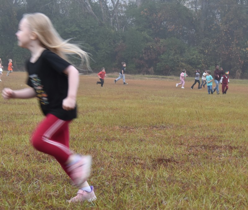 Students running and walking at the Turkey Trot.