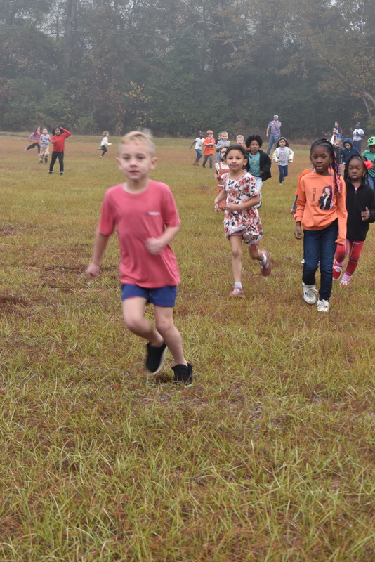 Students running and walking at the Turkey Trot.