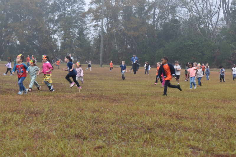 Students running and walking at the Turkey Trot.