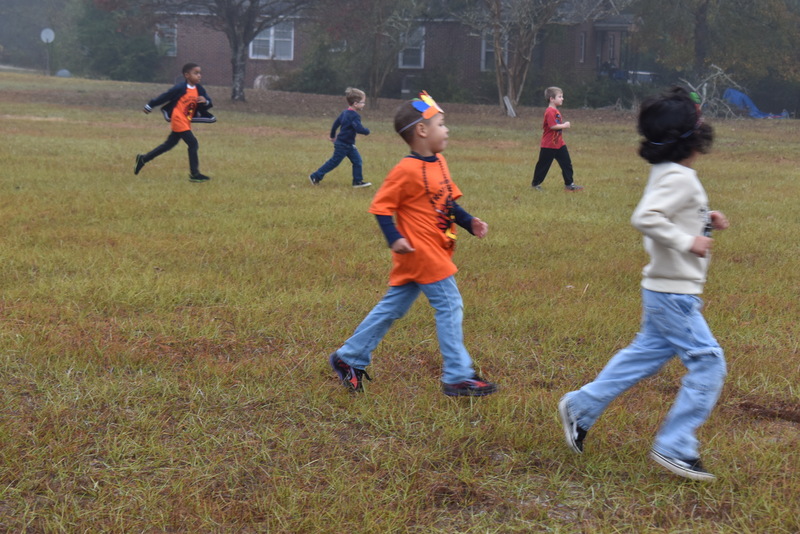 Students running and walking at the Turkey Trot.