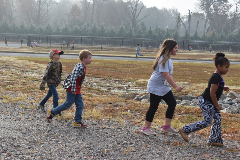 Students running and walking at the Turkey Trot.