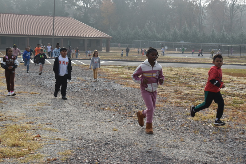 Students running and walking at the Turkey Trot.