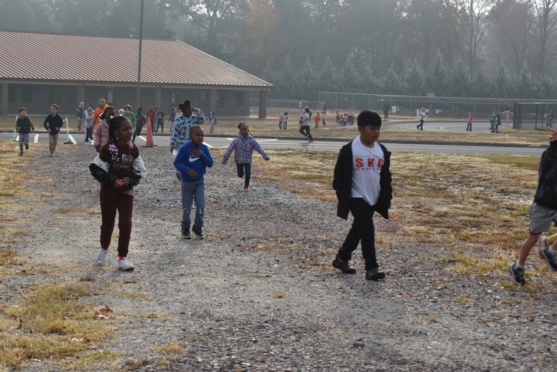 Students running and walking at the Turkey Trot.