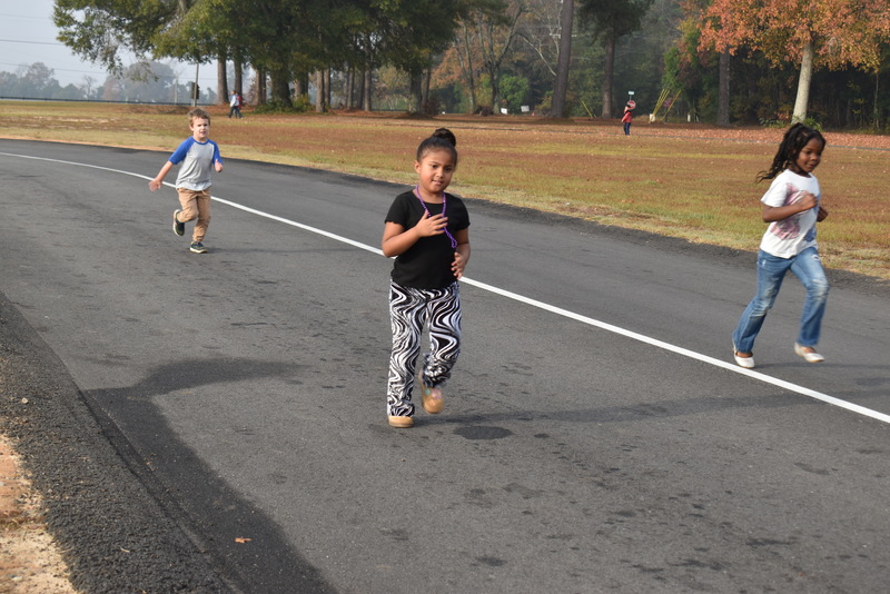 Students running and walking at the Turkey Trot.