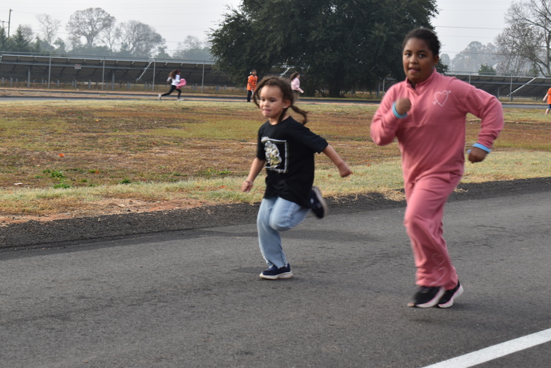 Students running and walking at the Turkey Trot.