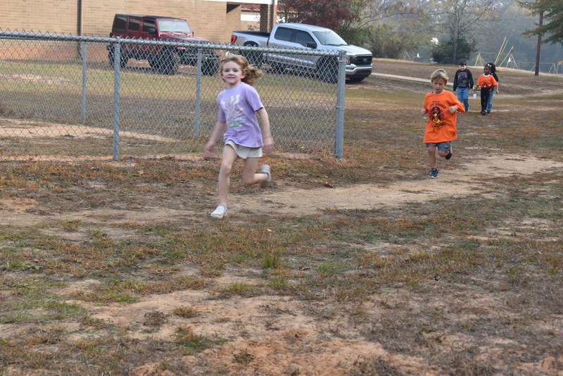 Students running and walking at the Turkey Trot.