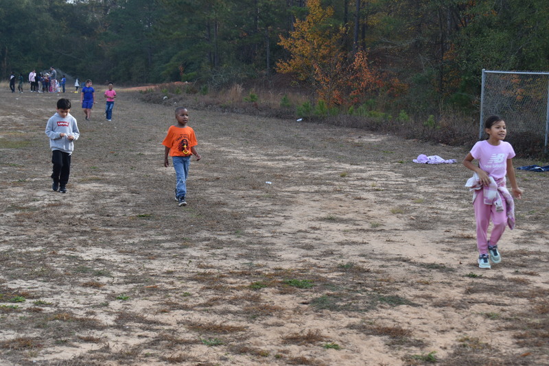 Students running and walking at the Turkey Trot.