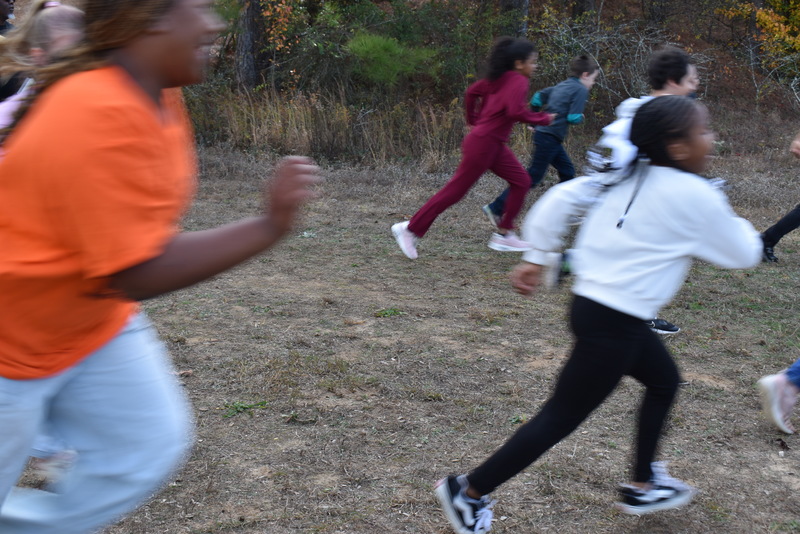 Students running and walking at the Turkey Trot.