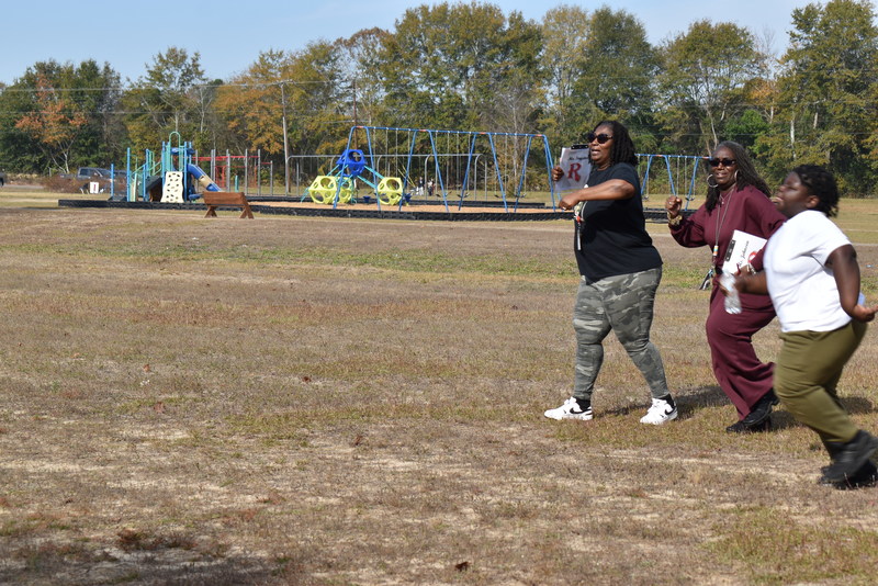 Students and staff running and walking at the Turkey Trot.