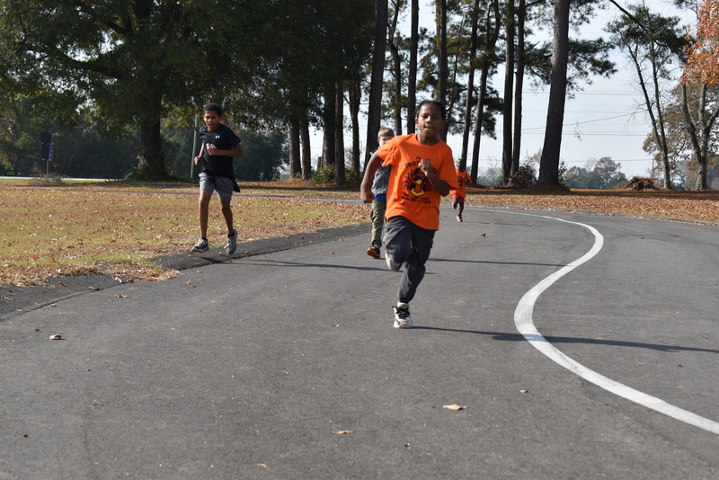 Students running and walking at the Turkey Trot.