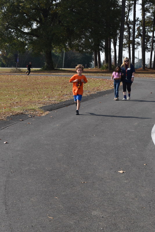 Students running and walking at the Turkey Trot.