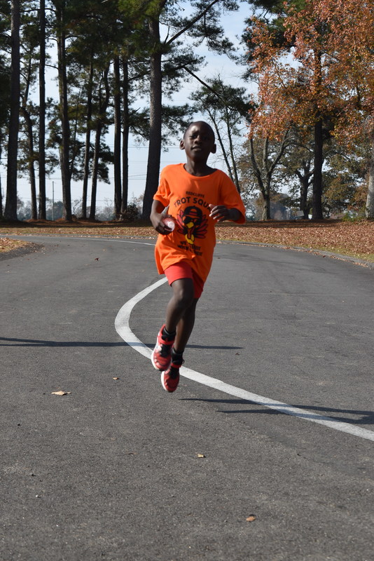 Students running and walking at the Turkey Trot.