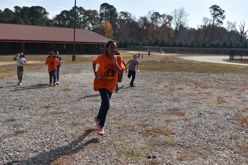 Students running and walking at the Turkey Trot.