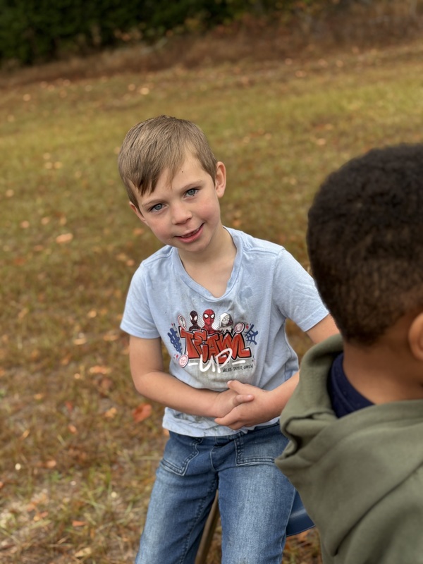 Students waiting at their Turkey Trot station.
