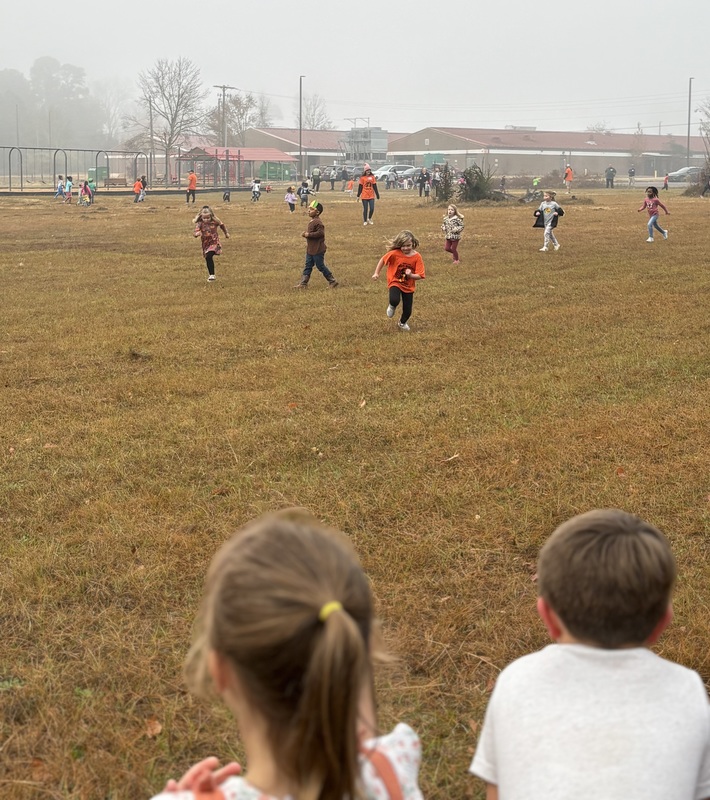 Students running and walking at the Turkey Trot.