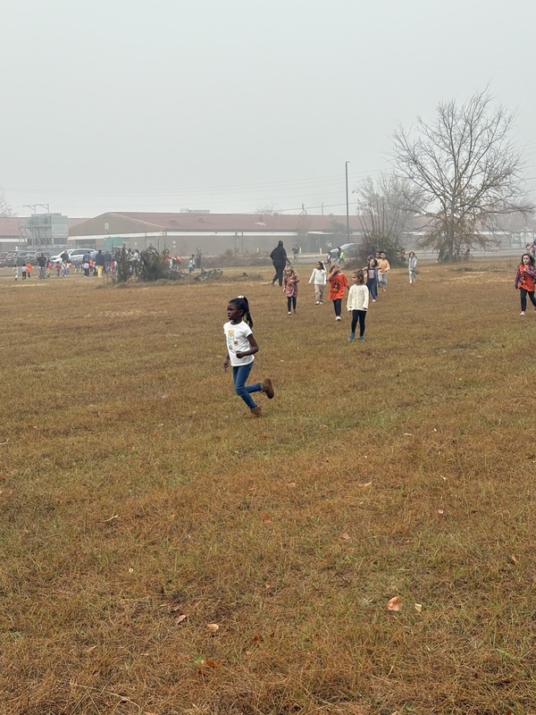 Students running and walking at the Turkey Trot.