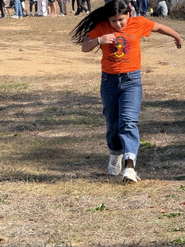 Students running and walking at the Turkey Trot.