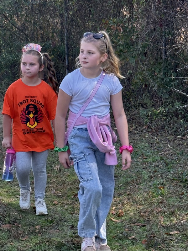 Students running and walking at the Turkey Trot.