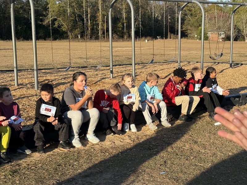 Runners watiing for awards.