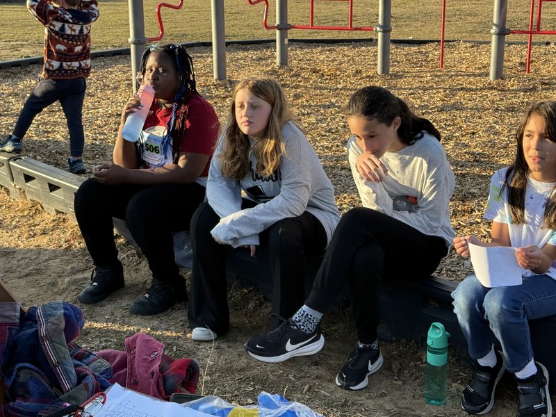 Runners at end of race.
