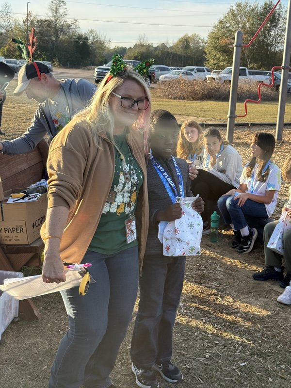 Runners with medals at end of race.