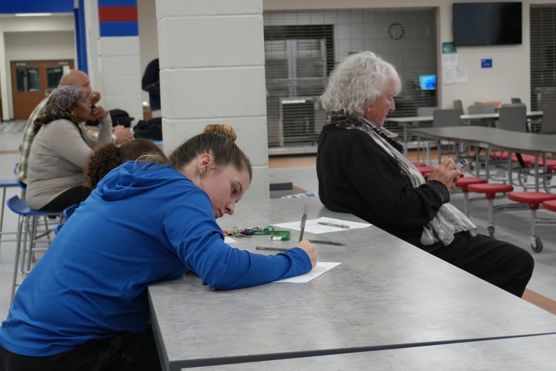 Parent participating in written survey.