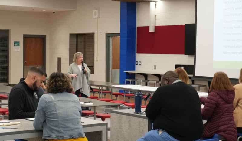 Cate Olin presenting data at community input meeting.