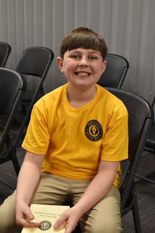 Student smiling in audience.