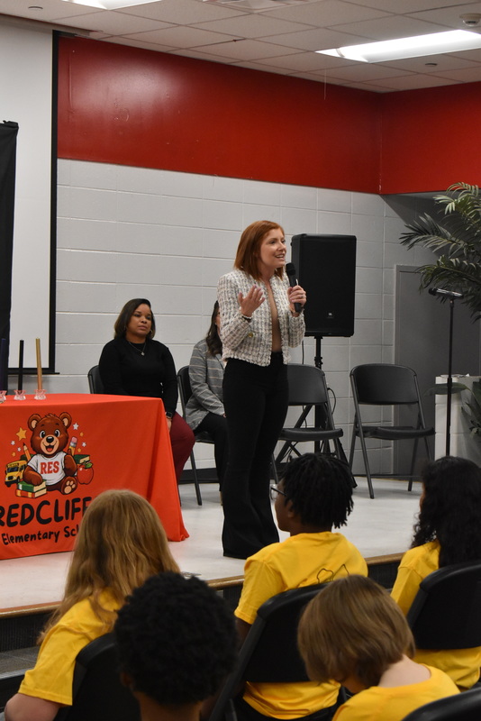 Staff speaking with microphone.